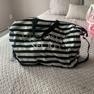 Silver and black striped travel bag